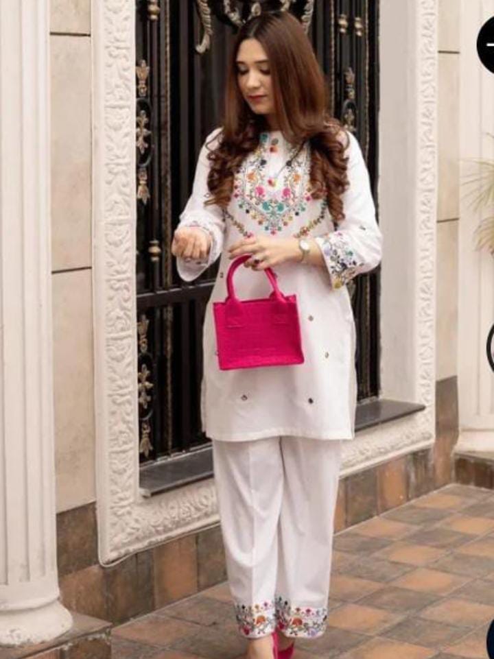 Elegant woman's 2pc suit shirt and trousers.